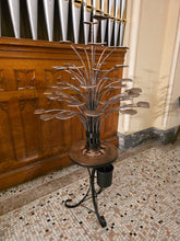 Steel candle platforms and textured branches before candles are added